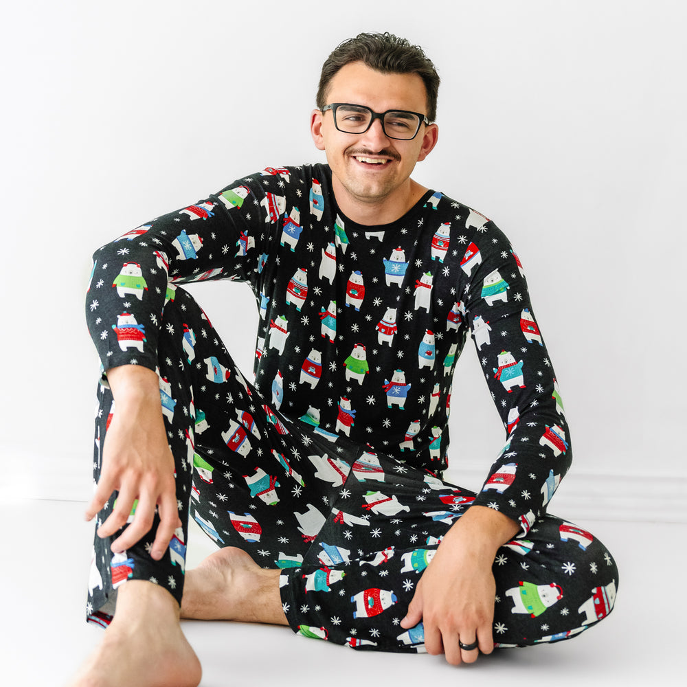 Man wearing matching Polar Bear Pals printed men's pajama top paired with men's pajama pants