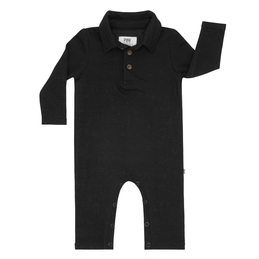 Flat lay image of a Black polo romper
