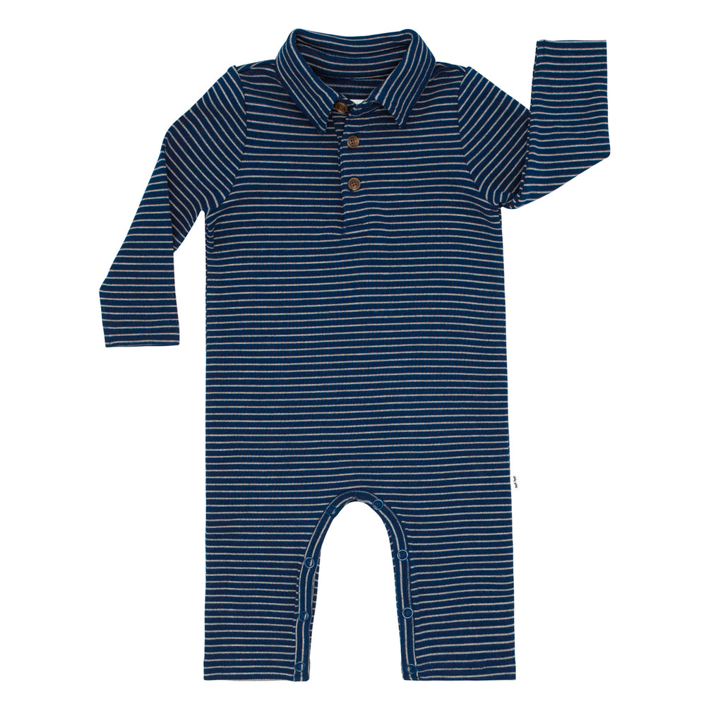 Flat lay image of a Classic Navy Stripes polo romper