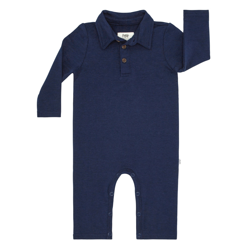 Flat lay image of a Classic Navy polo romper