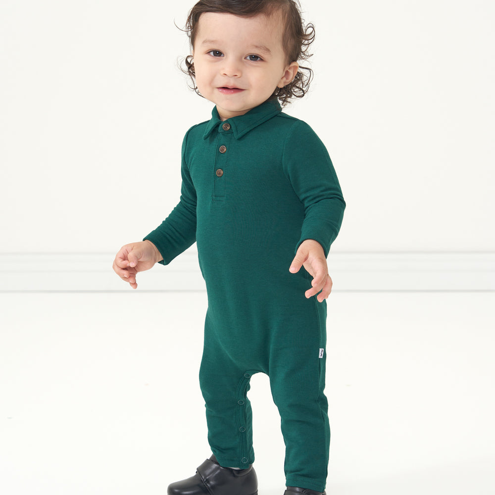 Child wearing an Emerald polo romper
