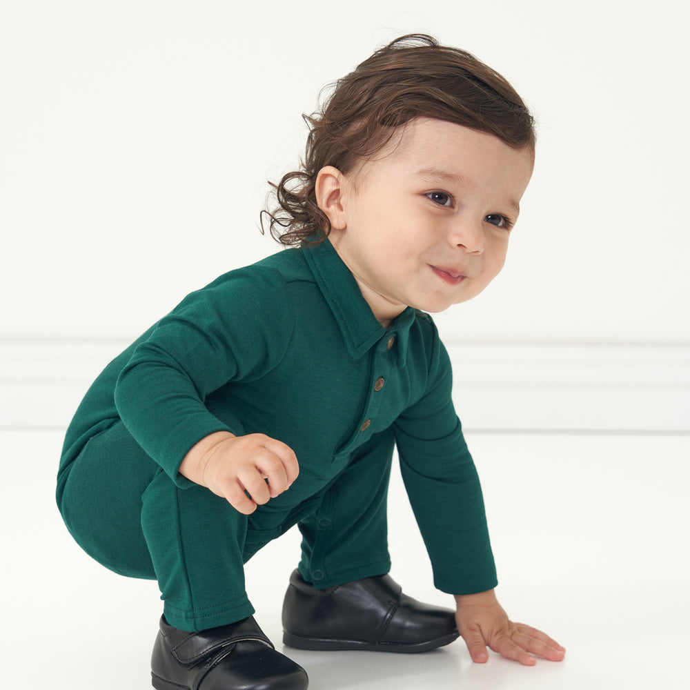 Alternate image of a child squatting wearing an Emerald polo romper