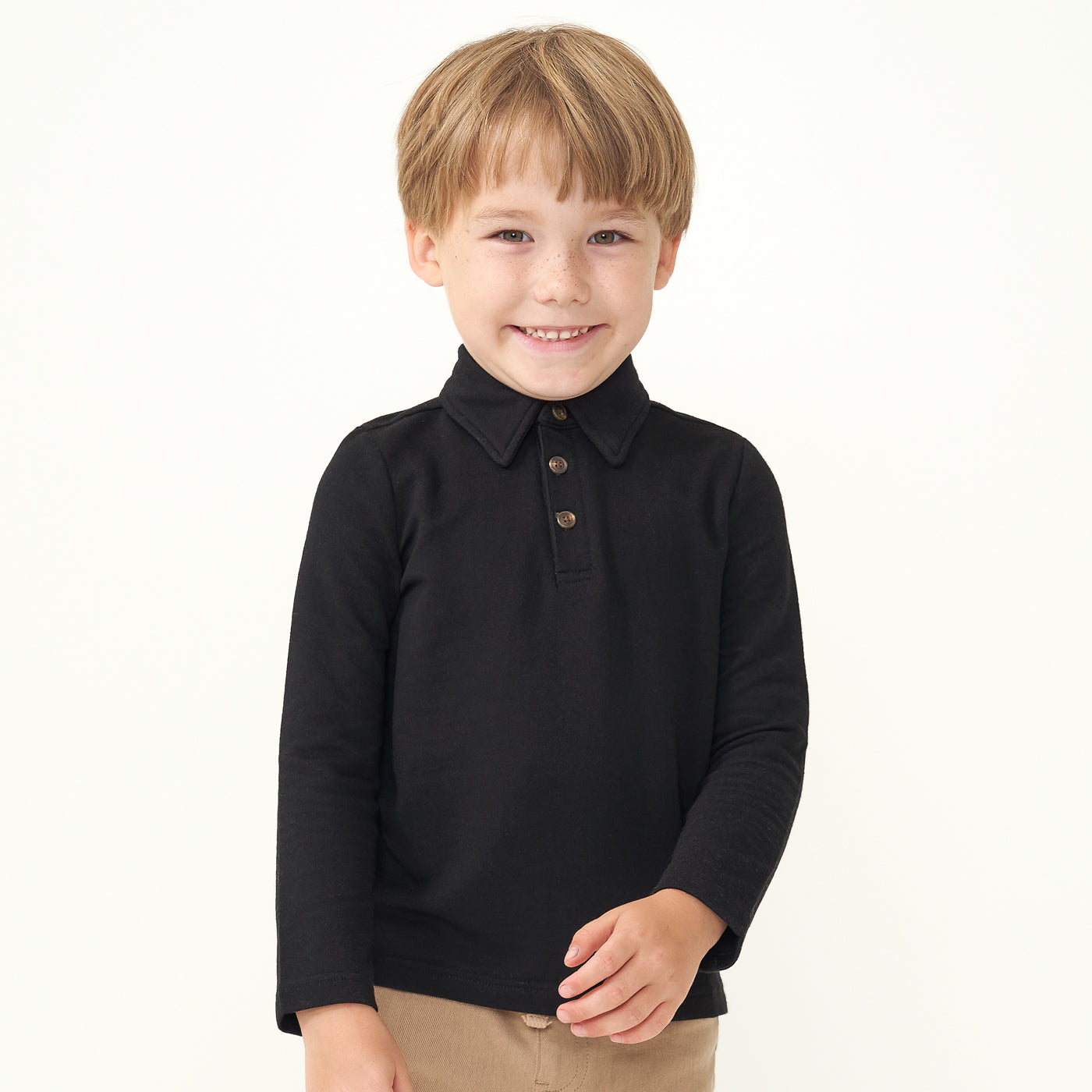 Child wearing a Black polo shirt