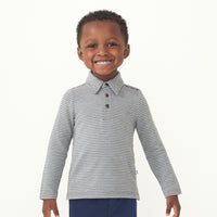 Child wearing a Heather Charcoal stripes polo shirt 