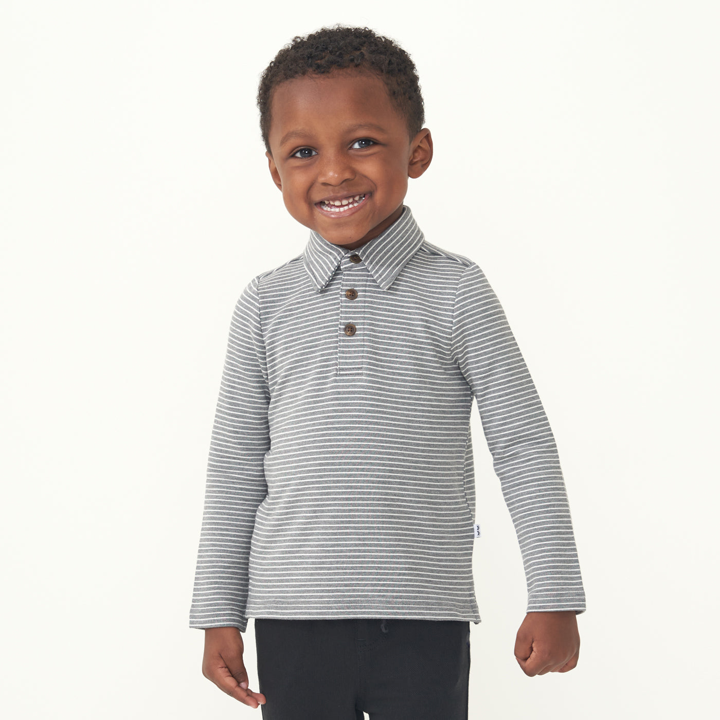 Child wearing a Heather Charcoal stripes polo shirt paired with Black joggers