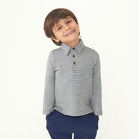 Child wearing a Heather Charcoal stripes polo shirt paired with Sapphire joggers