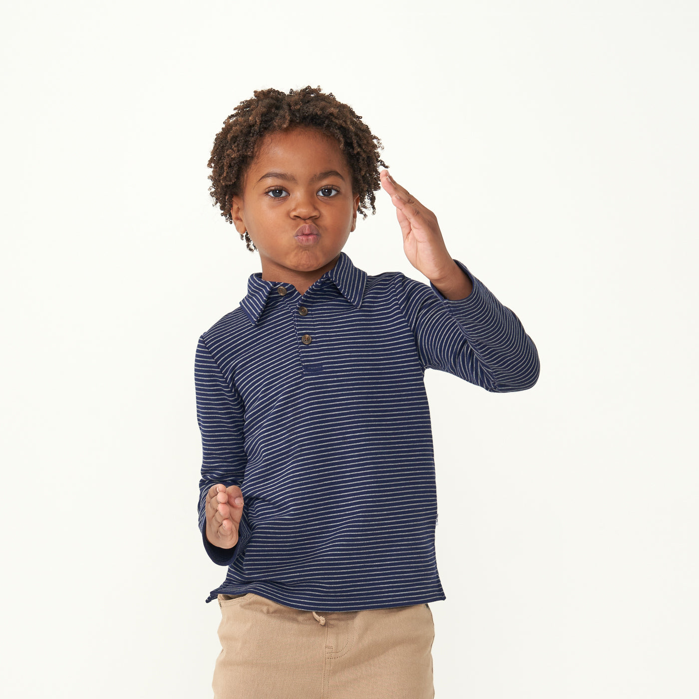 Child playing wearing a Classic Navy Stripes polo shirt