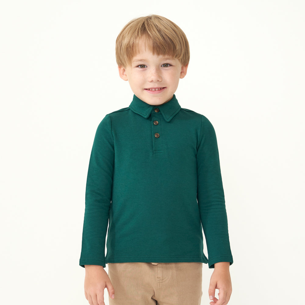 Child wearing an Emerald polo shirt