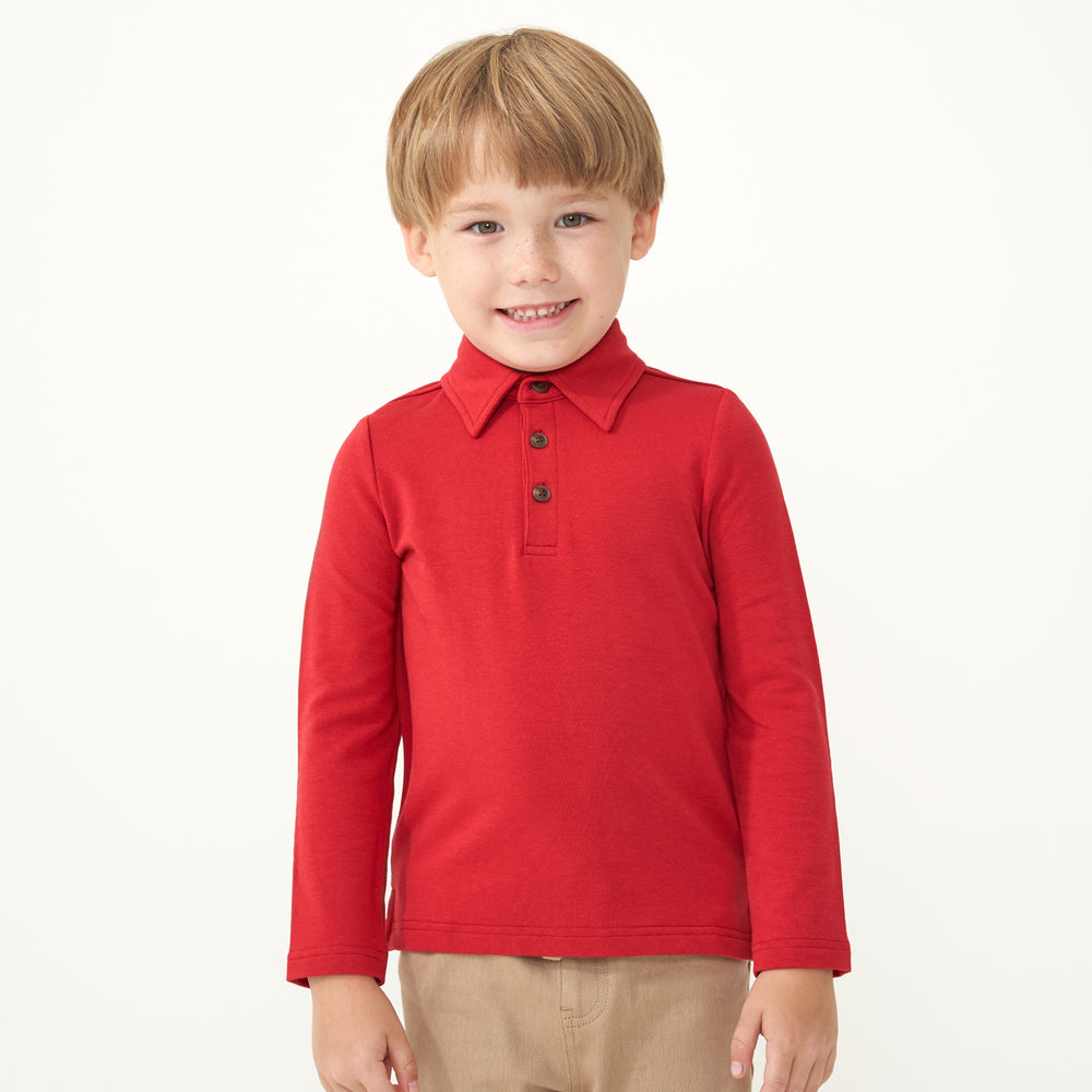 Child wearing a Holiday Red polo shirt