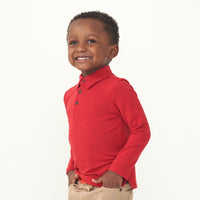 profile view of a Holiday Red polo shirt