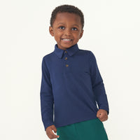 Alternate image of a child wearing a Classic Navy polo shirt