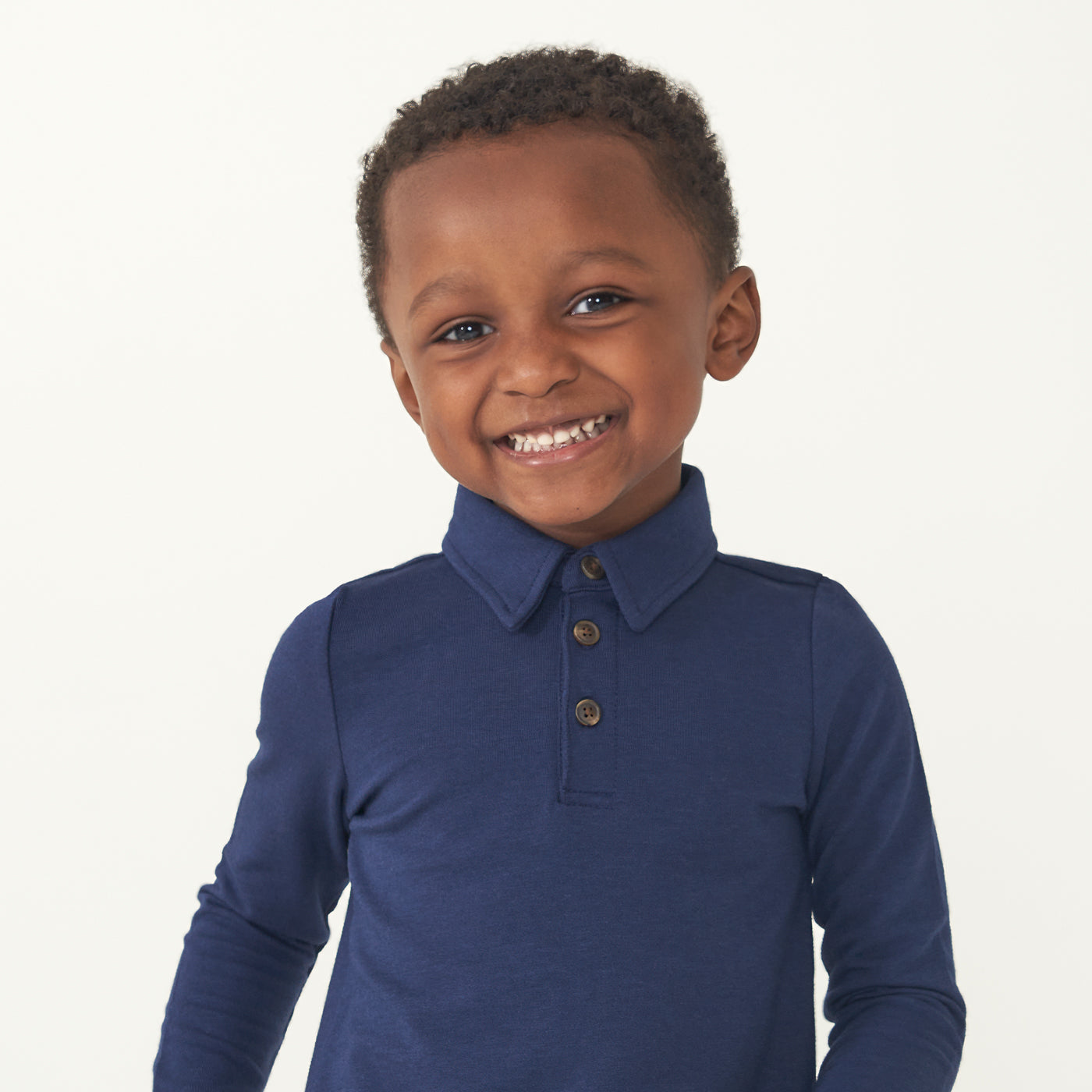 Alternate close up image of a child wearing a Classic Navy polo shirt