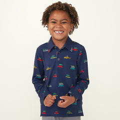 Child wearing a Tree Traffic polo shirt