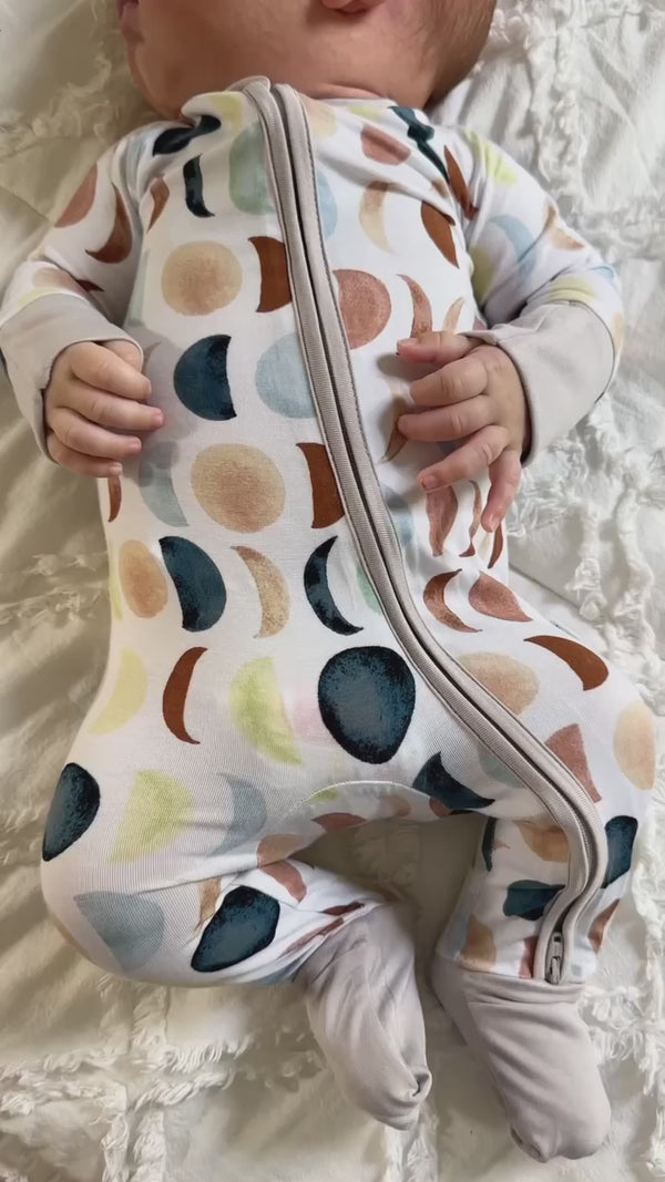 Baby wearing a Luna Neutral Zippy
