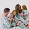 Video of a family wearing matching Peppermint Mocha pajamas