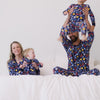 Video of a family wearing matching Playful Dreidels pajamas