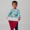 Boy wearing the Disney & Pixar Christmas Village Relaxed Pocket Tee with a Santa hat