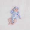 Top view video of baby laying down while wearing the Magical Meadow Flutter Bodysuit and Magical Meadow Luxe Bow