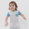 Video of a child wearing a Bluey graphic pocket shorty romper