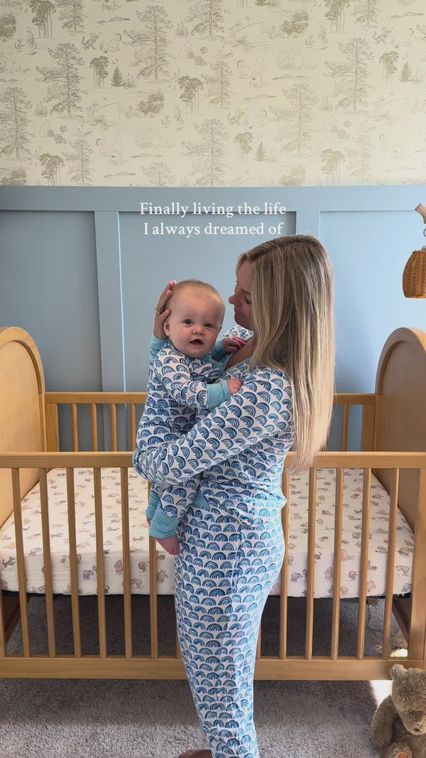Mother and child wearing matching Blue Rainbows pajamas
