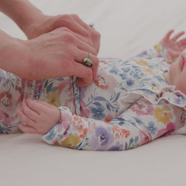 Adult demonstrating the waist fold over detail on the Tiny Blooms Fold-Over Legging