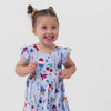 Video of a child wearing a Stars, Stripes & Sweets flutter twirl dress