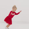 Video of red tutu skirt twirling.