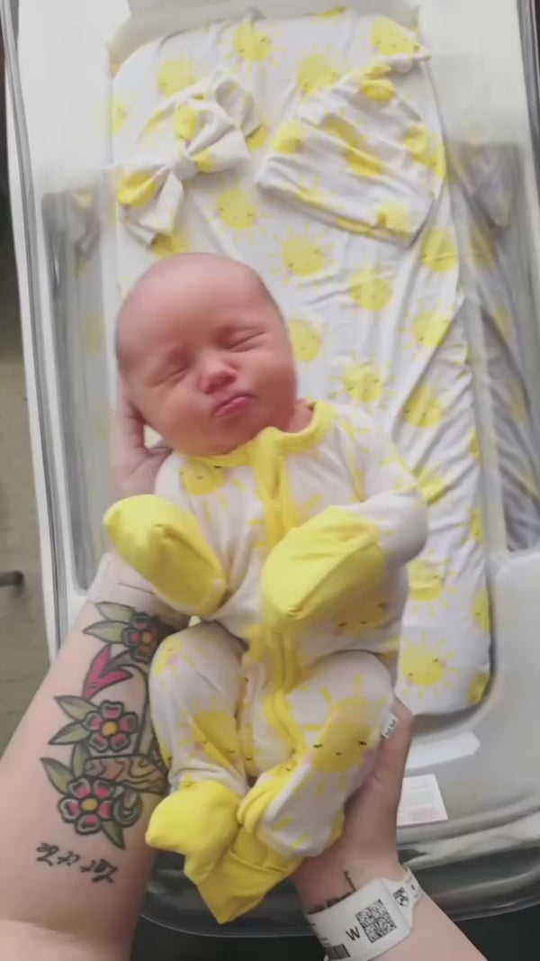 Infant wearing a Sunshine Zippy