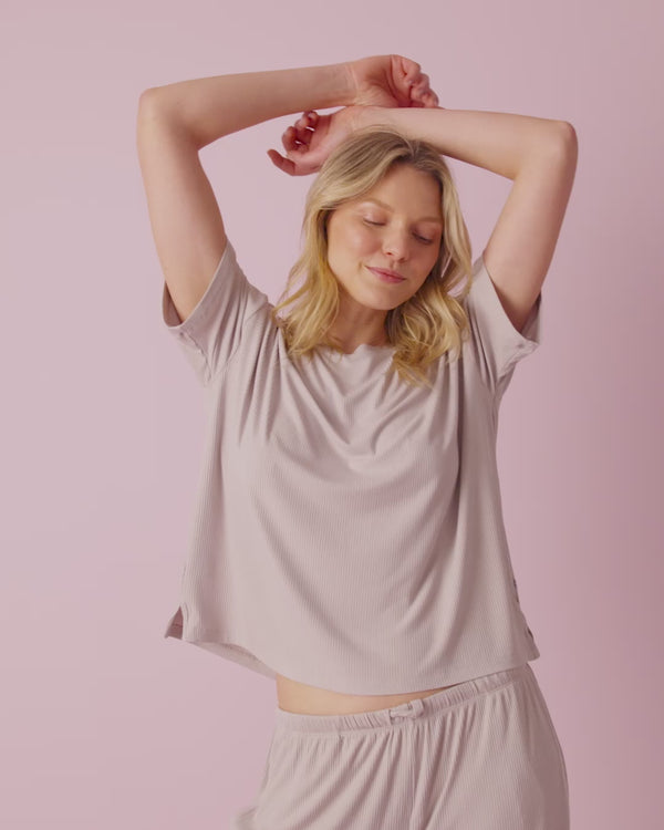 Woman wearing the Dove Gray Women's Ribbed Wide Leg Pant and Tee on a blush back drop