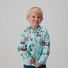 Boy zipping up the Disney & Pixar Christmas Village Zip Hoodie