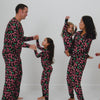 Family of five wearing matching Merry Mints Holiday pajamas