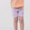 Video of a child playing in Sandy Treasures bike shorts paired with  a peach nectar flutter tee