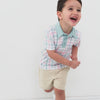 video of a child wearing a Playful Plaid polo shirt and coordinating chino shorts