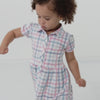 Video of a child wearing a Playful Plaid puff sleeve button down dress