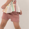 Video of a child wearing Desert Leopard dolphin shorts and coordinating Play top