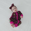 Baby girl wearing the Cranberry Tree Traffic Zippy