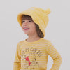 Video of children wearing a Winnie the Pooh sherpa bucket hat and coordinating outfits