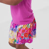 Video of children wearing a Rainbow Blooms skort and coordinating Play tops