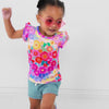 Video of children wearing a Rainbow Blooms Flutter Tee and coordinating Play bottoms