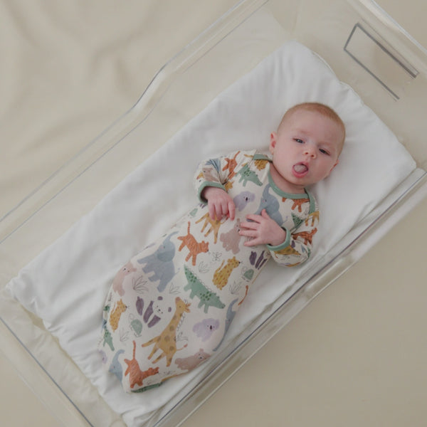 Infant laying in a bassinet wearing a Sweet Safari Infant Gown