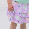 Video of a child playing wearing a Sandy Treasures skort paired with an Ocean Waves flutter tee