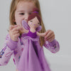 Girl playing with the Marie the Sugarplum Fairy Sleepyhead Lovey