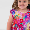Video of a child wearing a Rainbow Blooms Flutter Twirl Dress with Bodysuit