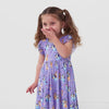 Video of a child wearing a Bluey flutter twirl dress