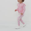 Video of a child wearing Rosy Meadow leggings and coordinating cardigan