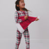Girl wearing the Holly Plaid Two-Piece Pajama Set and a Santa hat