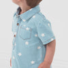 Video of a child wearing a Denim Stars polo shorty romper