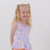 Video of children playing wearing a Sandy Treasures peplum tank paired with Ocean Waves bike shorts and Peach Nectar dolphin shorts