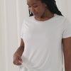 Video of a woman wearing and demonstrating a Bright White women's nursing top