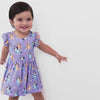 Video of a child wearing a Bluey flutter twirl dress with bodysuit